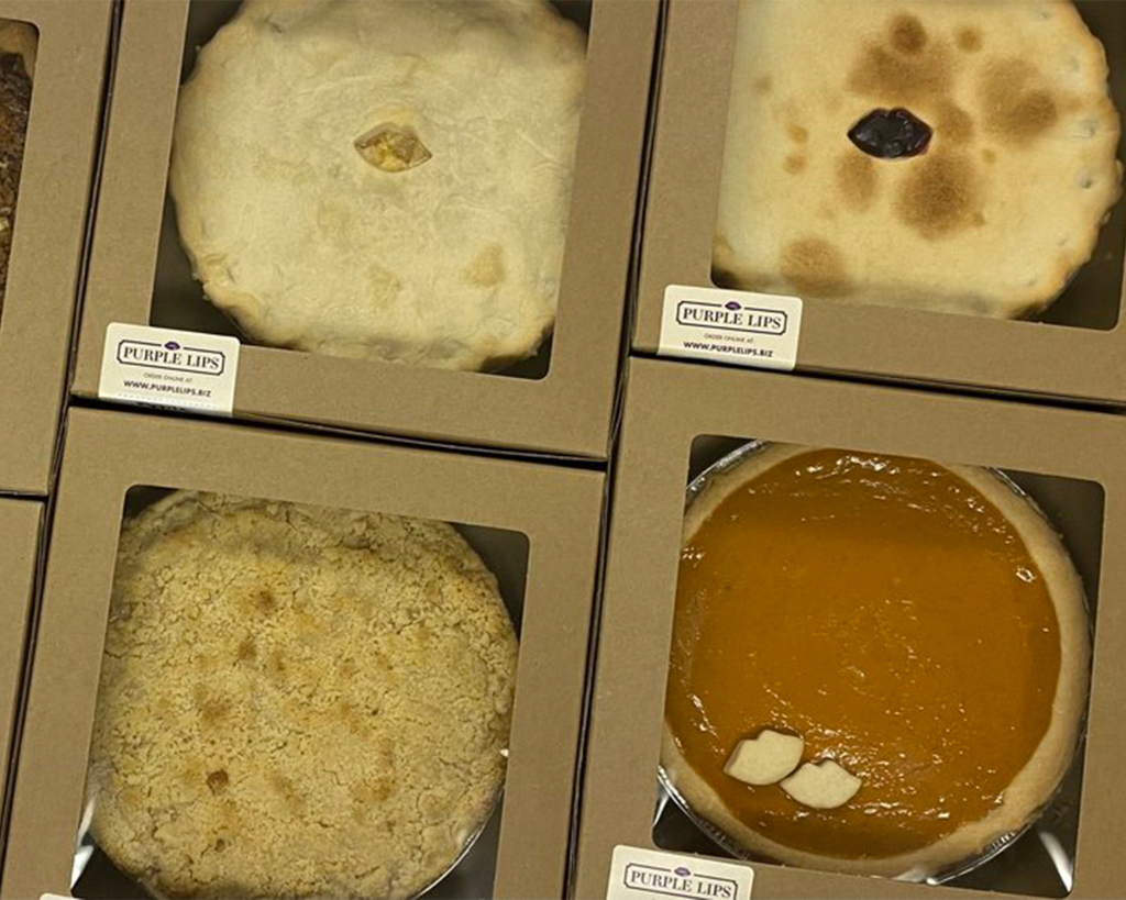 Assorted pies in boxes with clear top